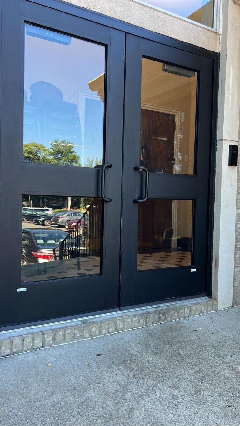 Black aluminum double entry doors installed by Pexic Windows