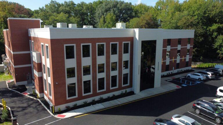 School building with curtain wall entrance and commercial windows by Pexic Windows
