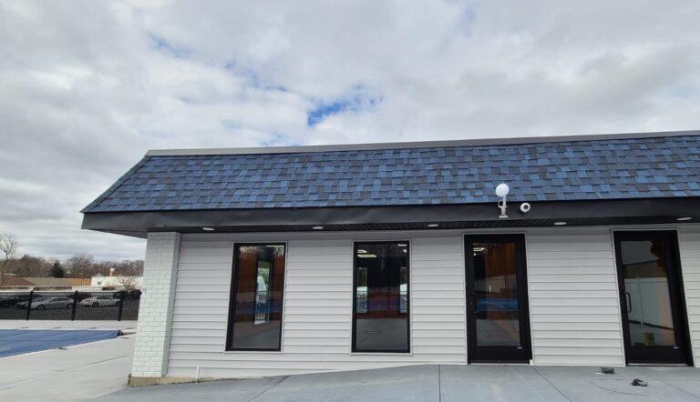 Storefront windows and entry doors on a clubhouse building by Pexic Windows