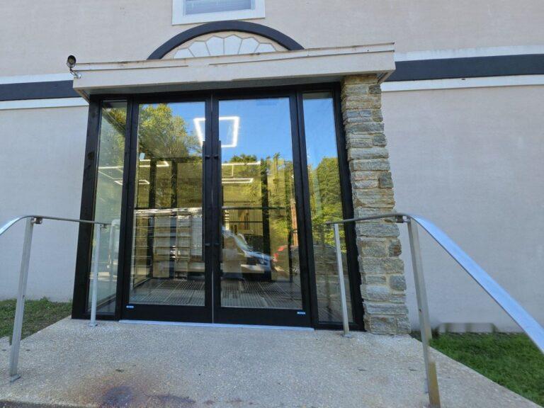 Glass double-door entrance with sidelites on a commercial building