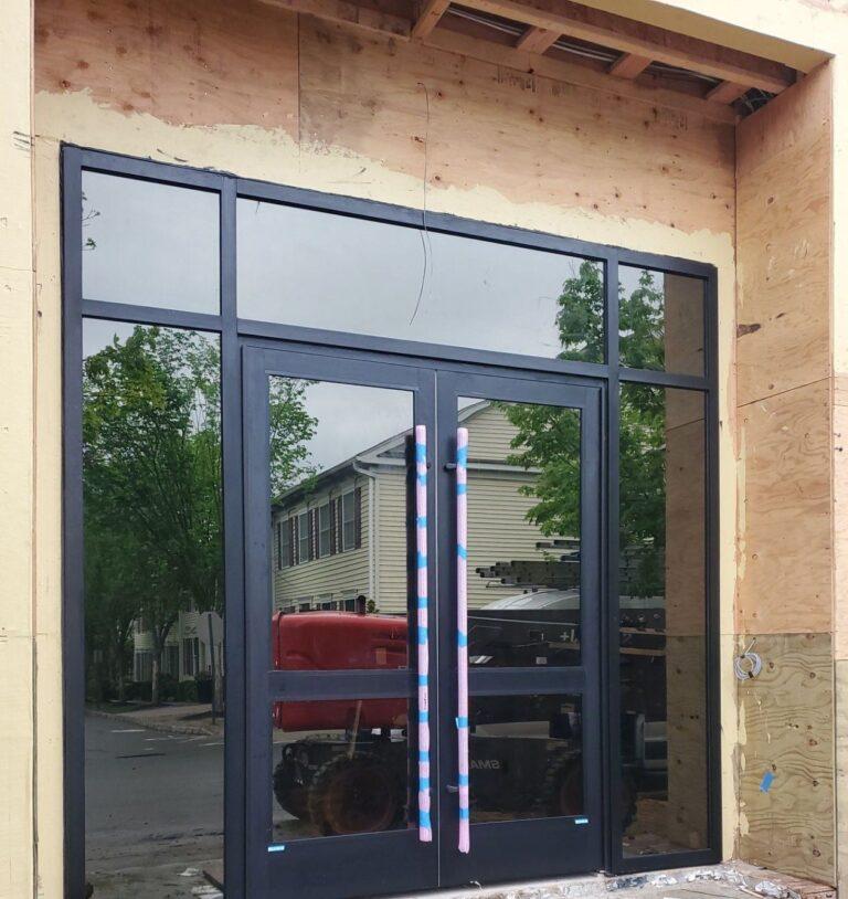 Aluminum double doors with transom and sidelites at a new entrance