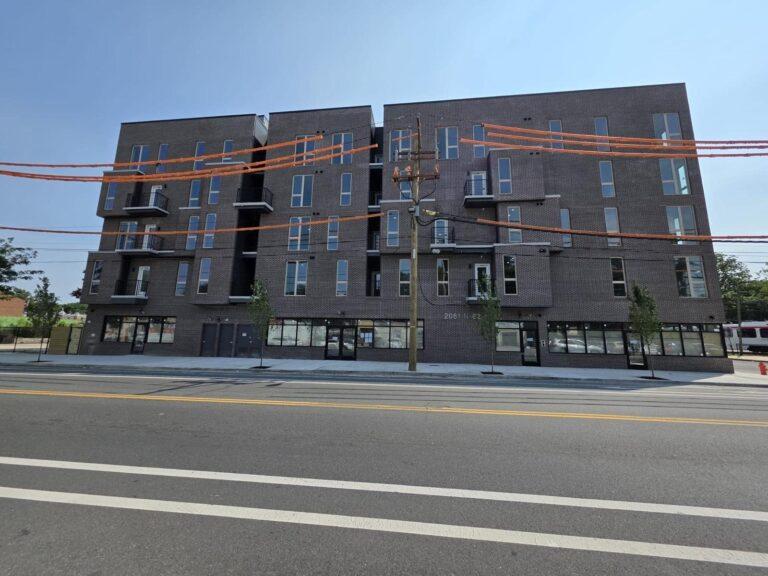 Ground-floor storefronts on a five-story mixed-use building by Pexic Windows
