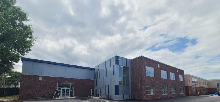 Glass stair tower and entrance on a school addition by Pexic Windows