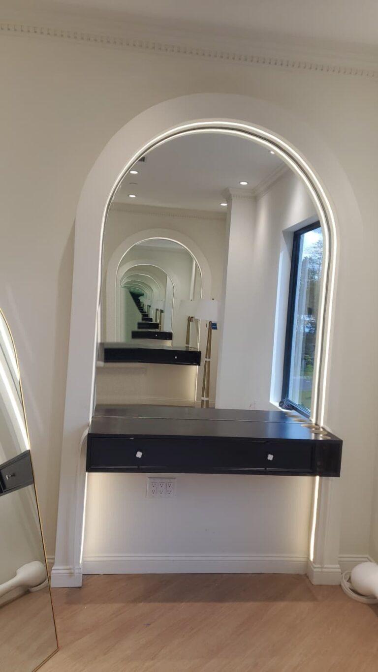 Arched vanity mirrors in a bathroom by Pexic Windows
