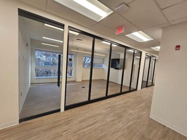 Black-framed glass office partitions and door by Pexic Windows