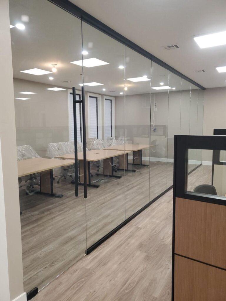 Frameless glass wall and door on a conference room by Pexic Windows