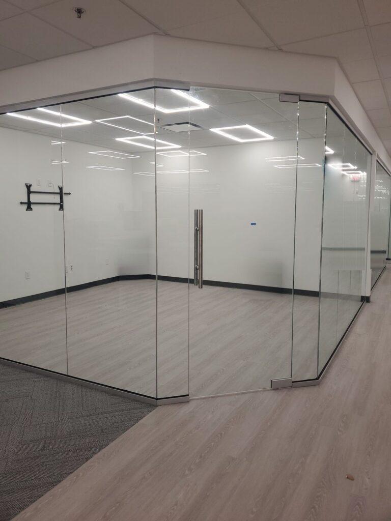 Corner office enclosed in frameless glass by Pexic Windows