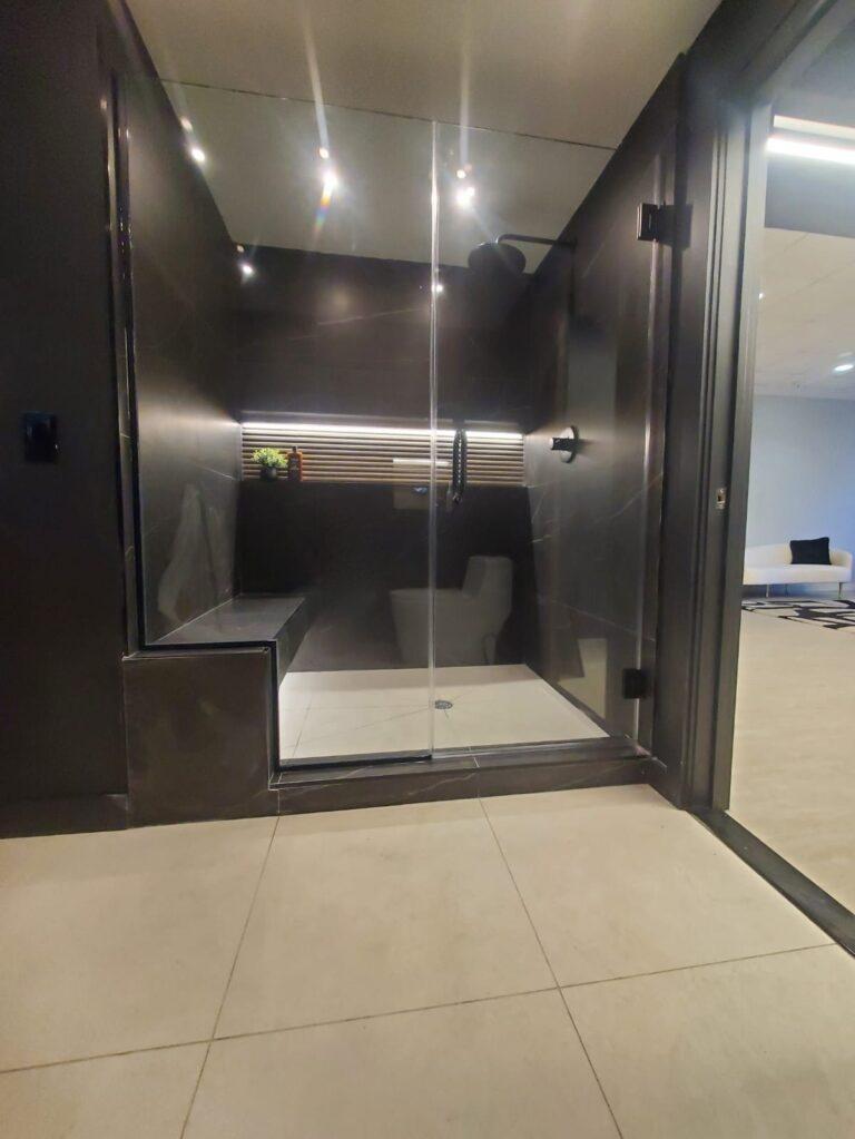 Frameless glass shower enclosure by Pexic Windows