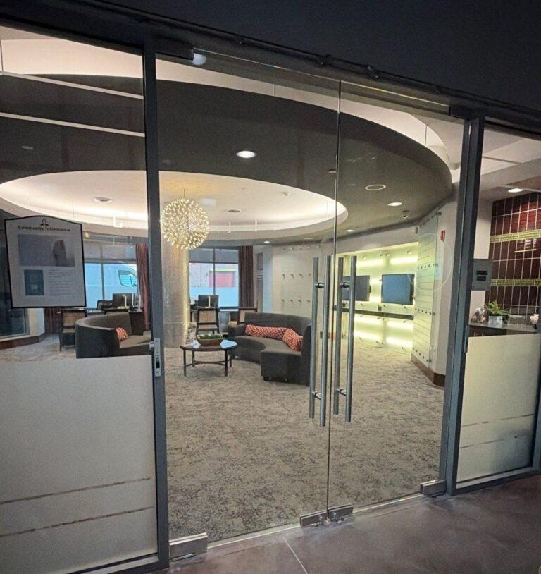 Glass double doors into a resident lounge by Pexic Windows