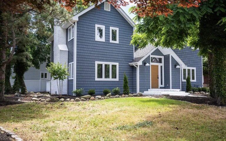 Blue shingle home with new white windows by Pexic Windows