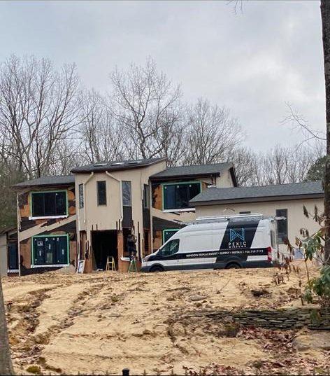 Pexic Windows van at a modern home under construction by Pexic Windows